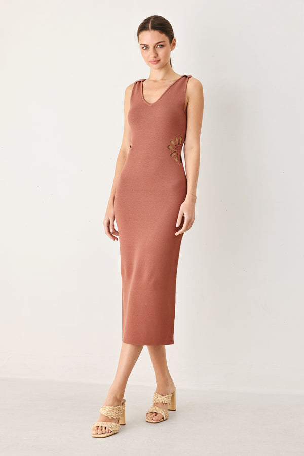 Woman wearing a clay colored sweater knit midi dress featuring V neckline and side cut out in a flower shape | FREEMARKET