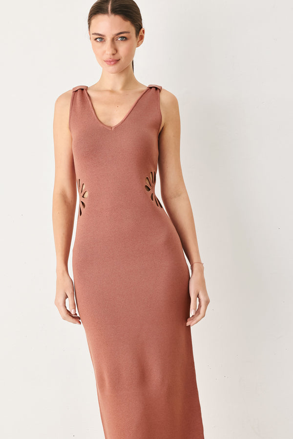 Woman wearing a clay colored sweater knit midi dress featuring V neckline and side cut out in a flower shape | FREEMARKET