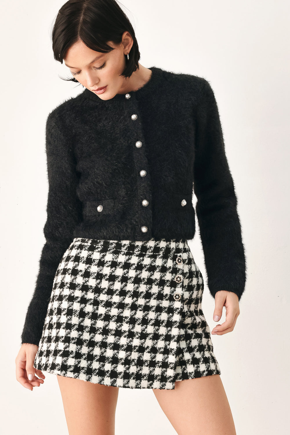 A model wearing an ivory fuzzy cropped cardigan with buttons | FREEMARKET