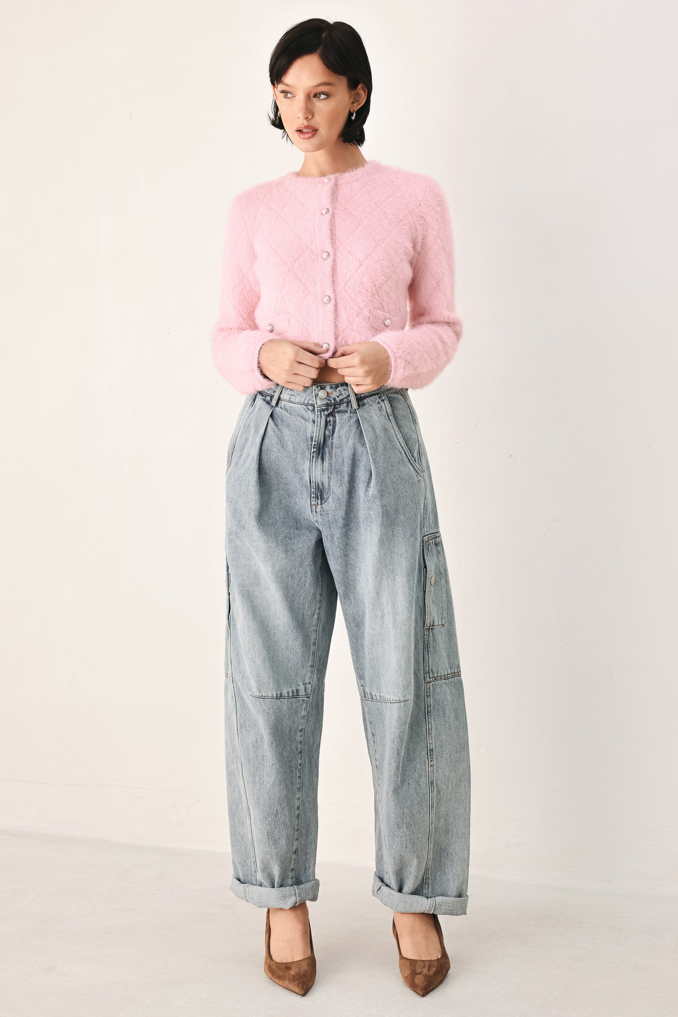 A model wearing a pink fuzzy cropped cardigan with buttons | FREEMARKET