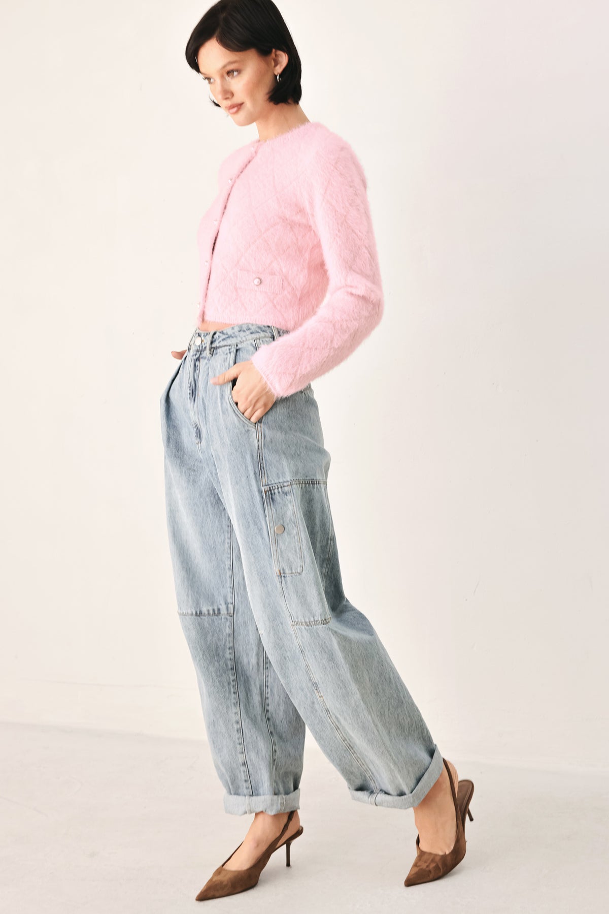 A model wearing a pink fuzzy cropped cardigan with buttons | FREEMARKET