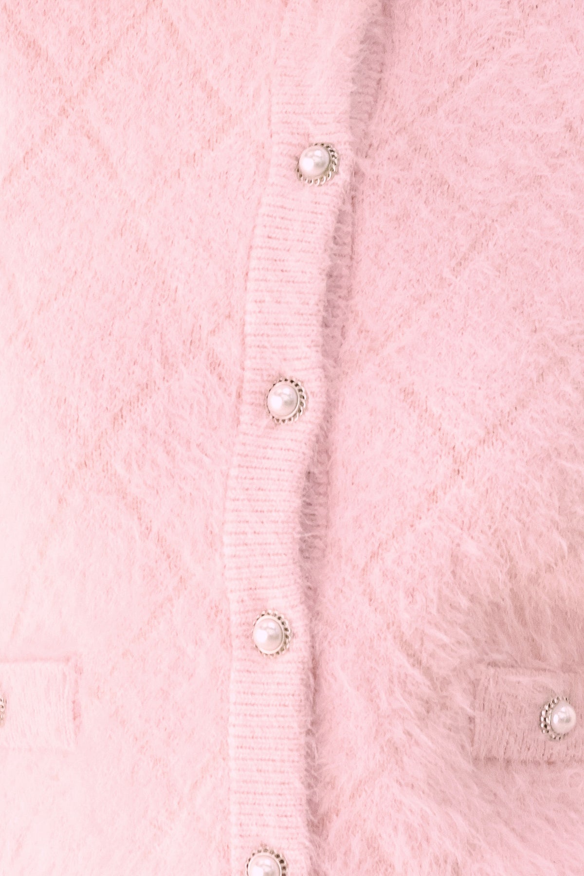 A model wearing a pink fuzzy cropped cardigan with buttons | FREEMARKET