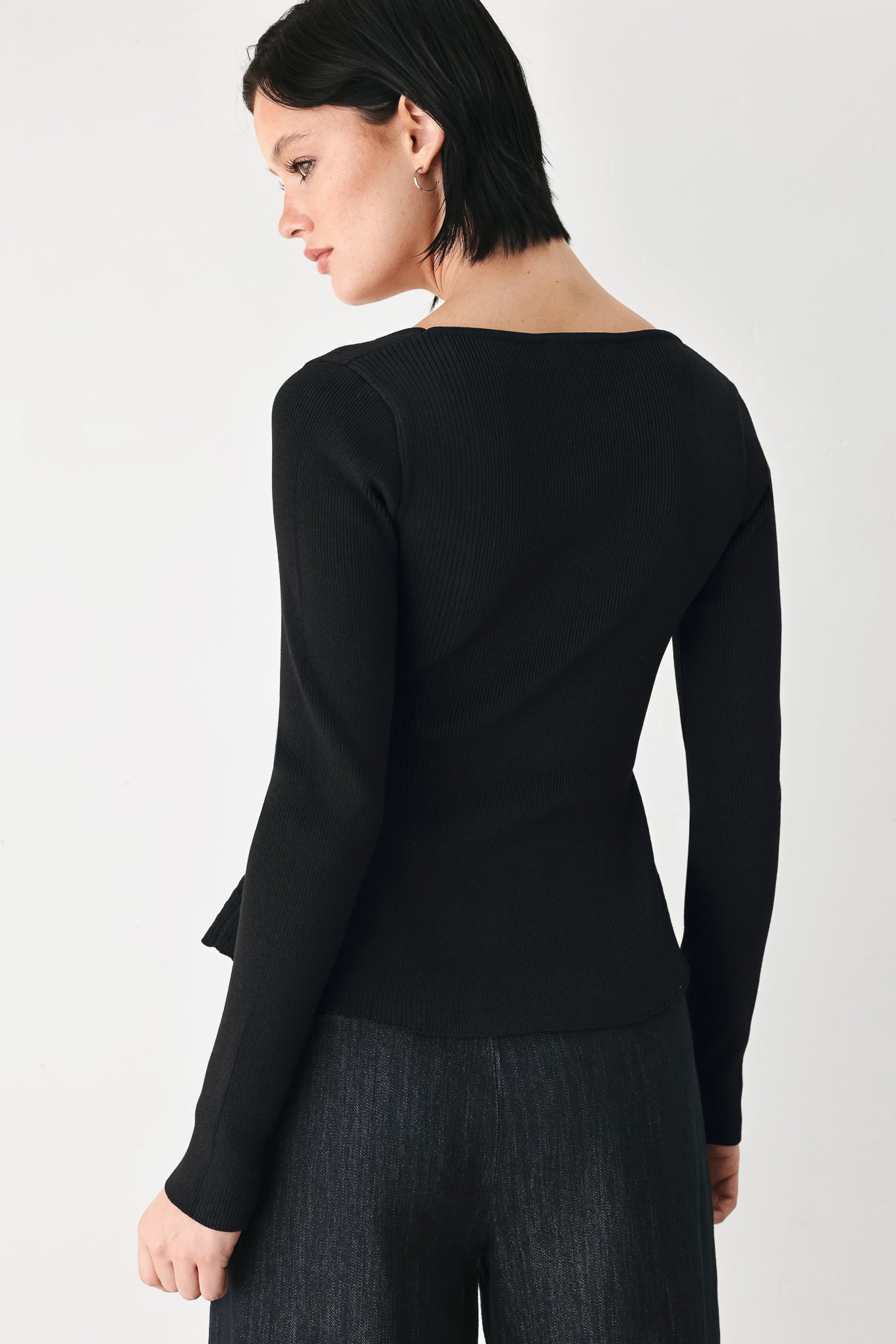 A model wearing a black long-sleeve top with a square neckline and delicate lace trim | FREEMARKET