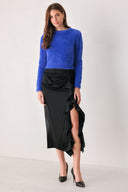A woman wearing a fuzzy cobalt blue long-sleeve knit sweater top | FREEMARKET