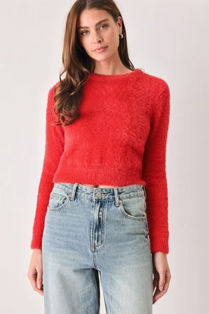 A woman wearing a fuzzy, textured red long-sleeve crop sweater | FREEMARKET