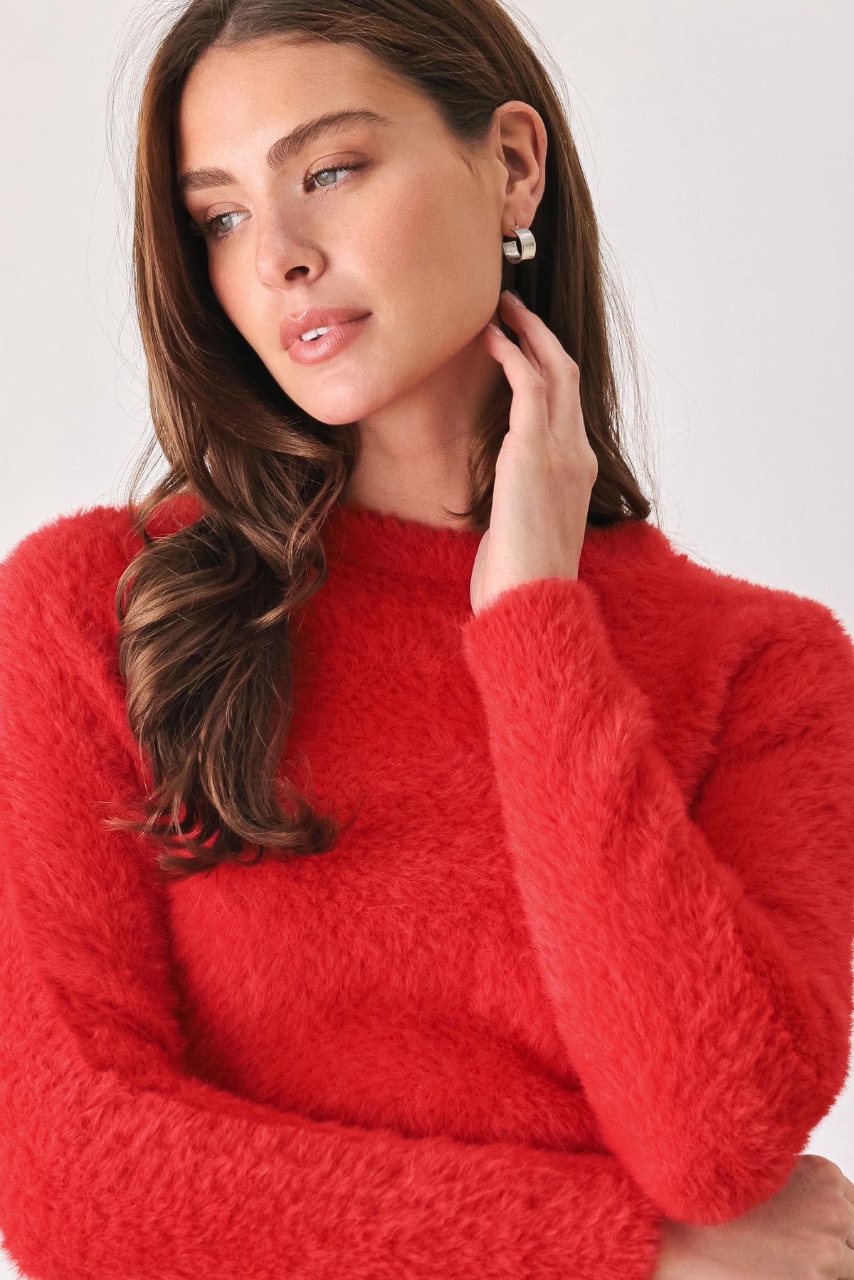A woman wearing a fuzzy, textured red long-sleeve crop sweater | FREEMARKET