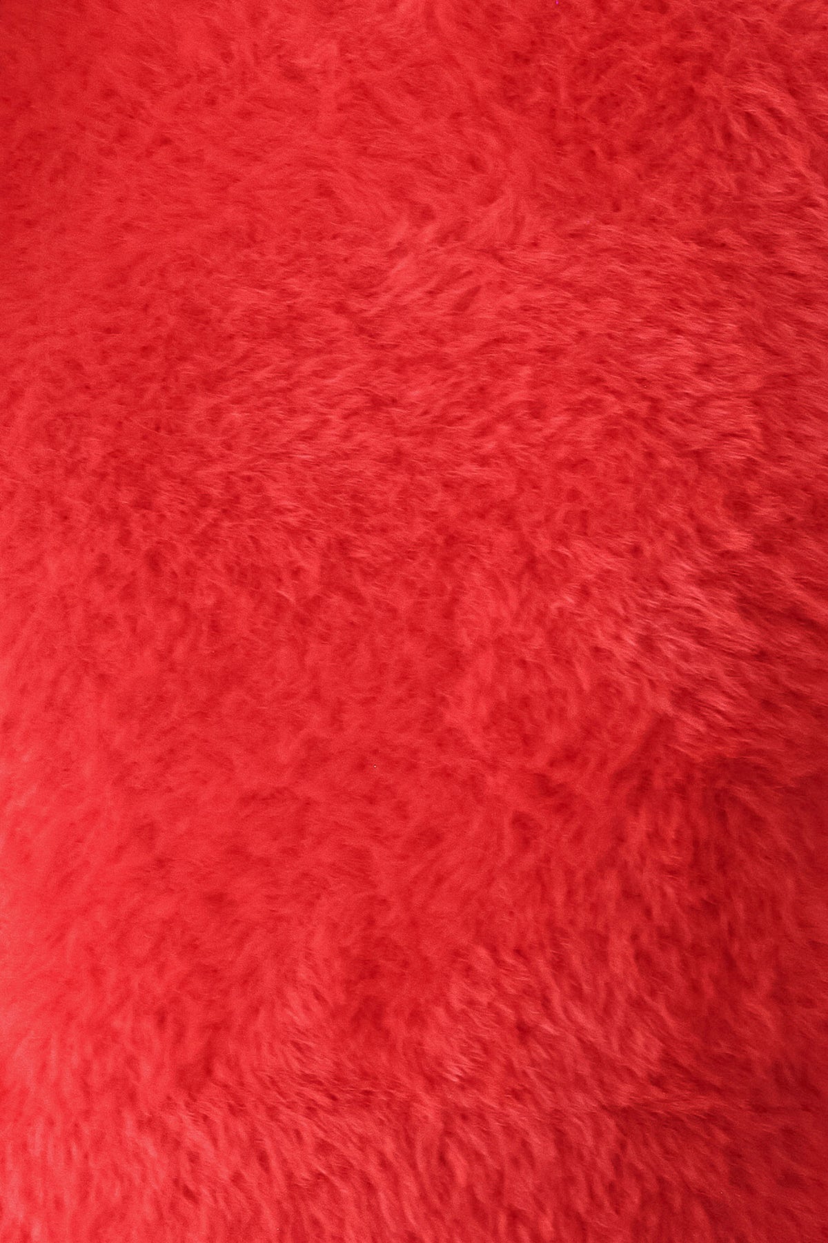 A woman wearing a fuzzy, textured red long-sleeve crop sweater | FREEMARKET