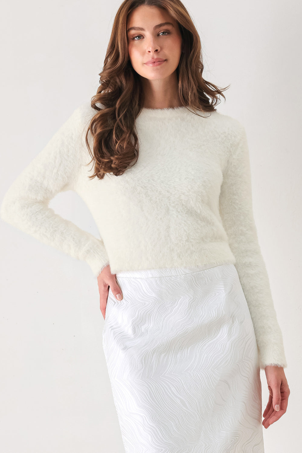 A woman wearing a fuzzy cobalt blue long-sleeve knit sweater top | FREEMARKET