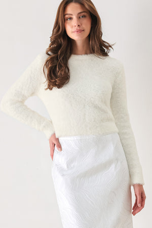 A woman wearing a fuzzy off-white long-sleeve sweater top | FREEMARKET