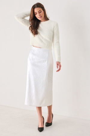 A woman modeling a fuzzy off-white long-sleeve sweater top | FREEMARKET