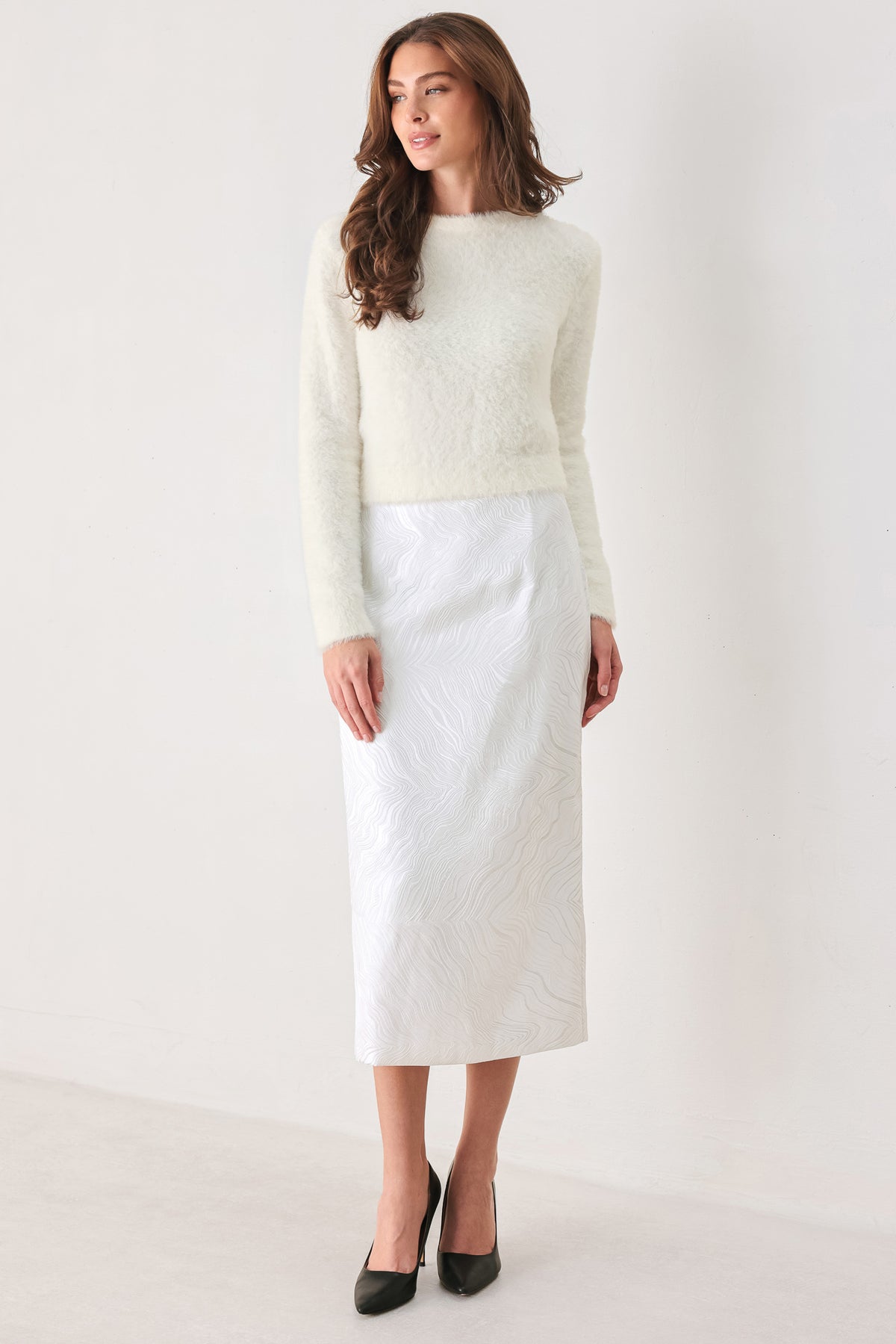 A woman modeling a fuzzy off-white long-sleeve sweater top | FREEMARKET