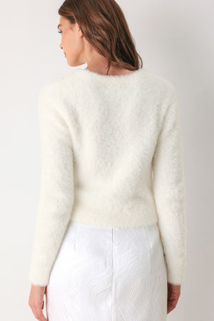 A woman modeling a fuzzy off-white long-sleeve sweater top | FREEMARKET