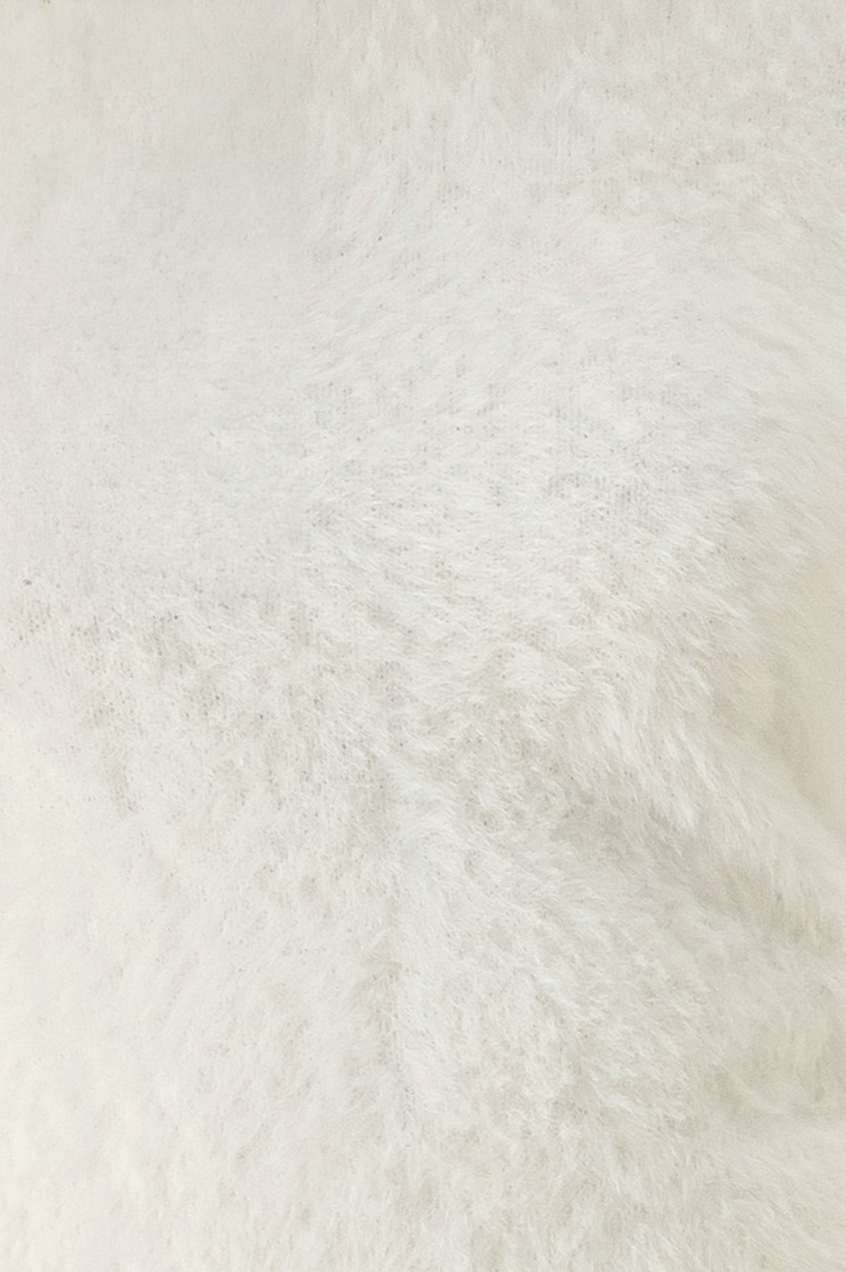A woman modeling a fuzzy off-white long-sleeve sweater top | FREEMARKET