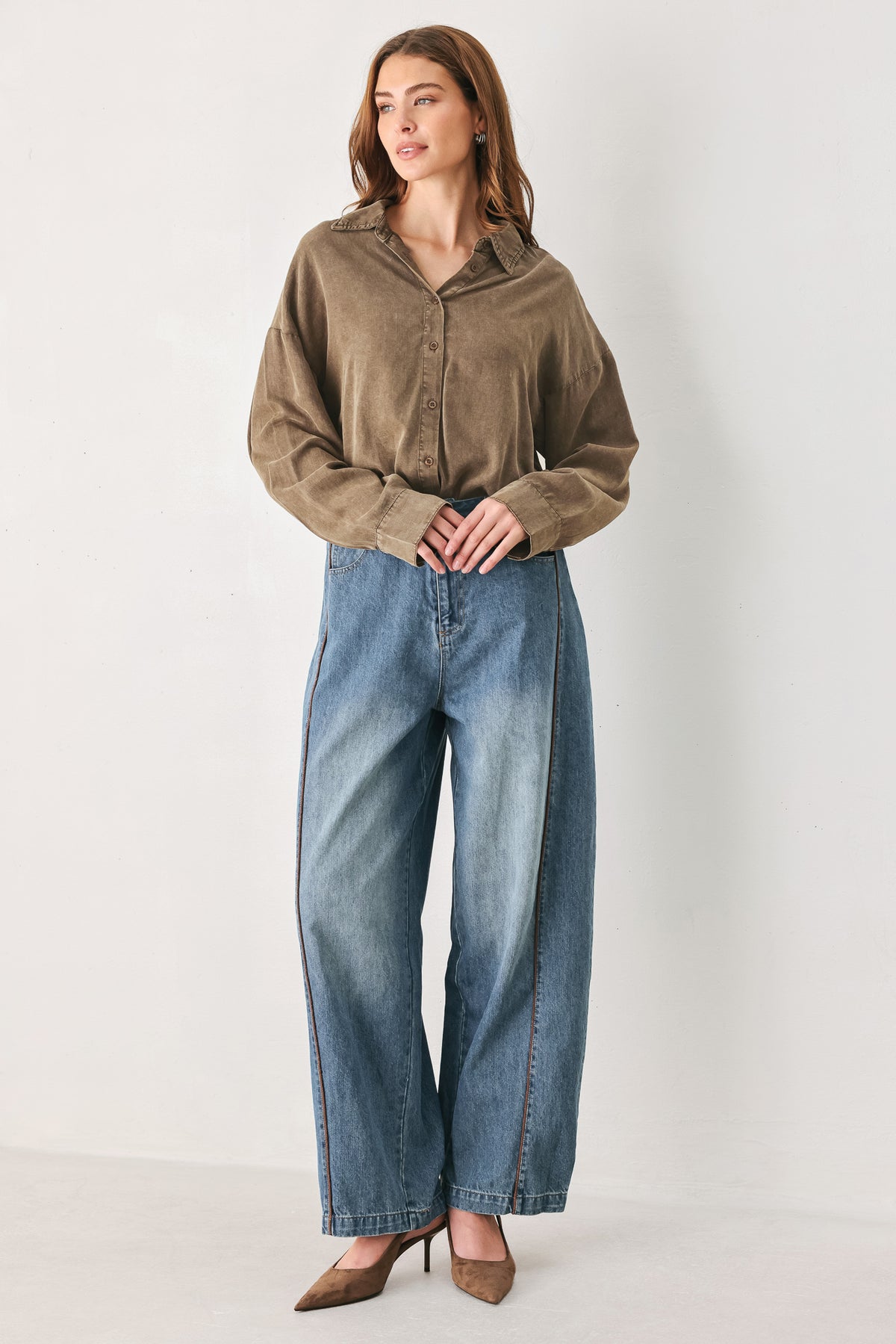 Woman wearing a brown button-up shirt bodysuit | FREEMARKET