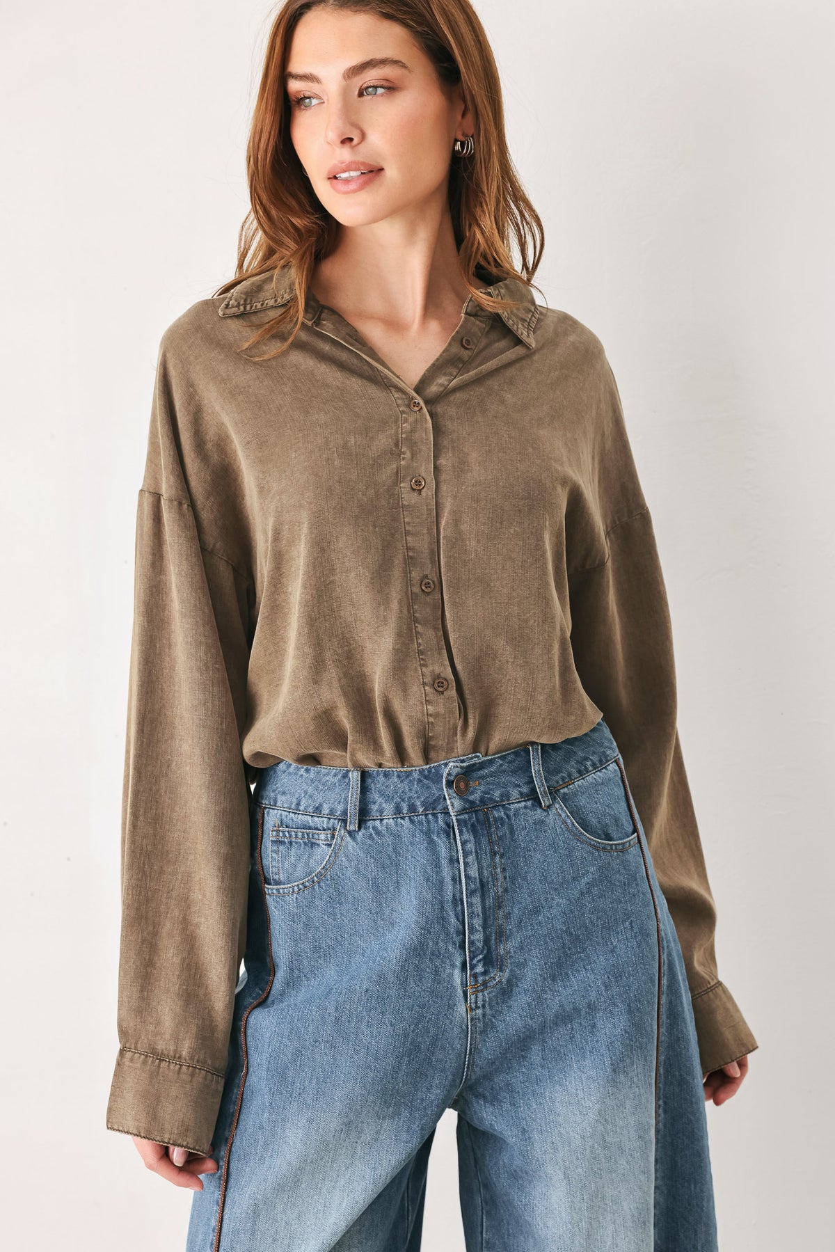 Woman wearing a brown button-up shirt bodysuit | FREEMARKET