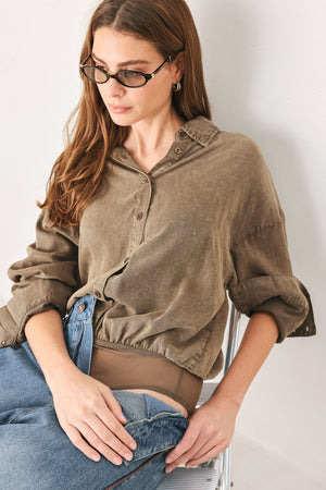 Woman wearing a brown button-up shirt bodysuit | FREEMARKET