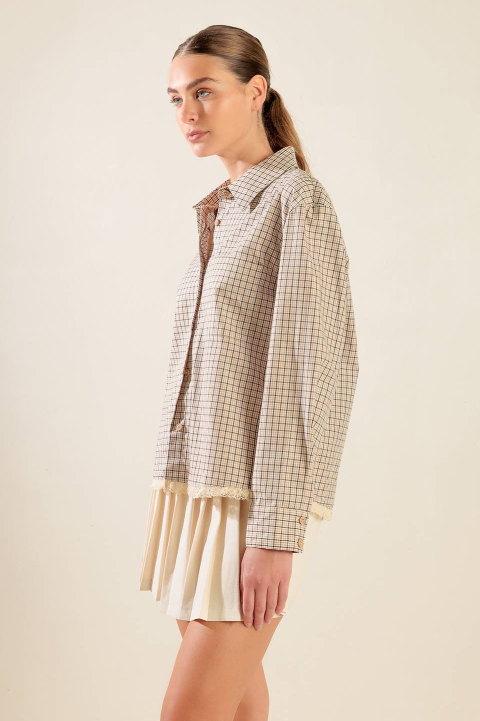 
A plaid woven top featuring button down, long sleeve and lace trim hemline

Details:

Self : 100% Cotton
(exclusive of decoration)

Size &amp; Fit

- Model is 5`8" And Wearing Size Small
- Measurements Taken From Size Small
- Approx. Length: 24"