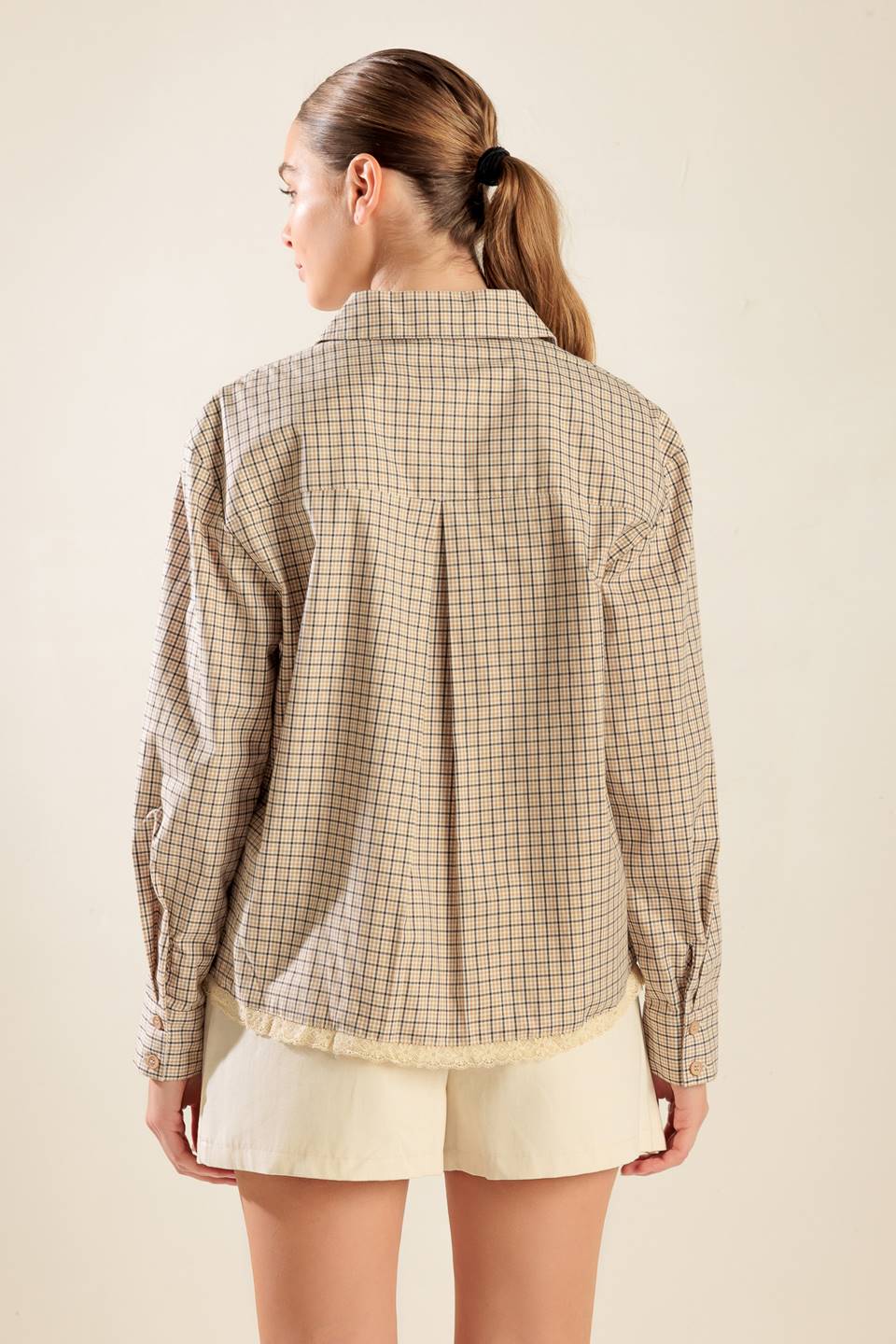 
A plaid woven top featuring button down, long sleeve and lace trim hemline

Details:

Self : 100% Cotton
(exclusive of decoration)

Size &amp; Fit

- Model is 5`8" And Wearing Size Small
- Measurements Taken From Size Small
- Approx. Length: 24"