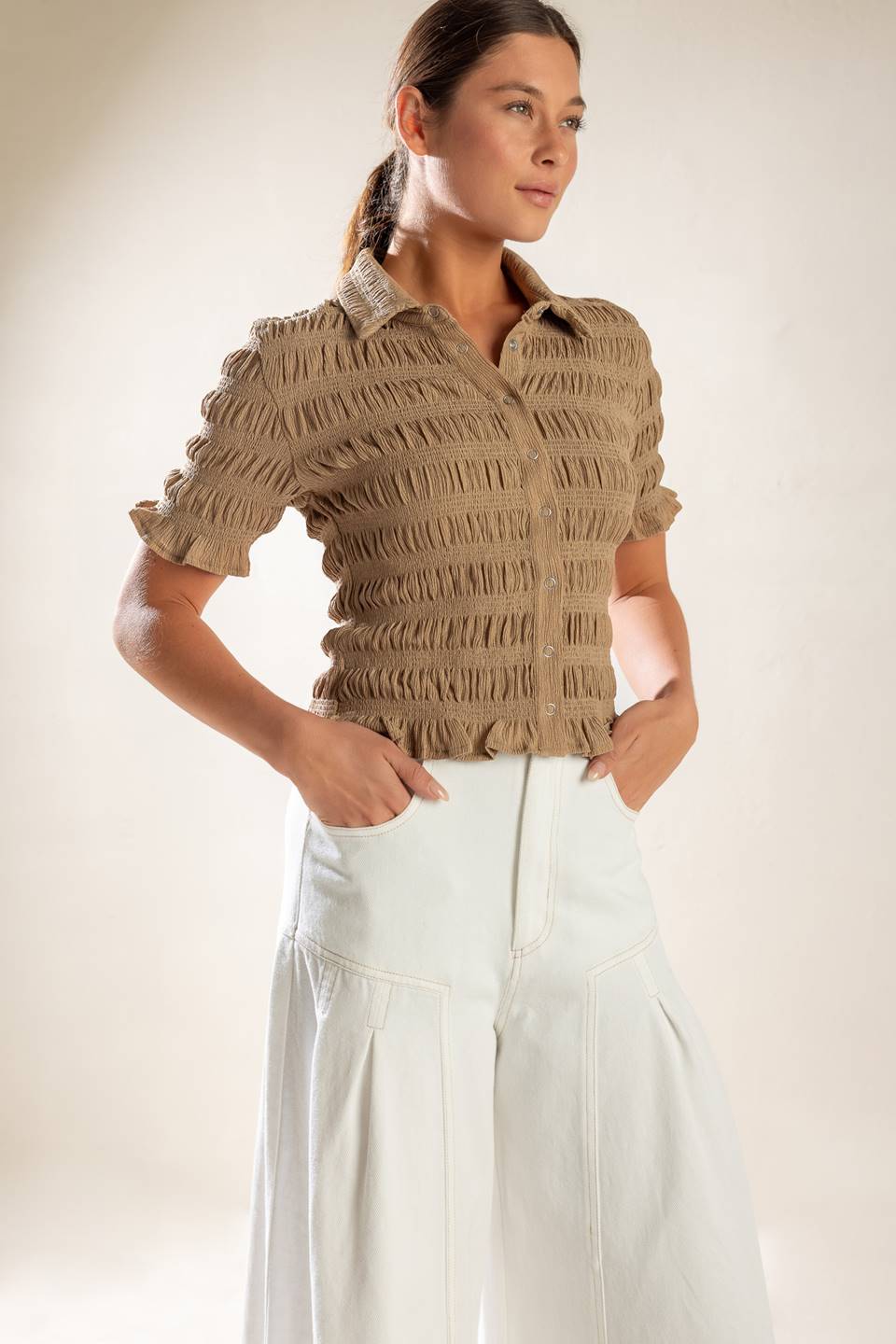 Expertly crafted, this textured woven top boasts a classic shirt collar, button down closure, and short sleeves.