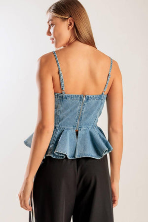 A washed denim top featuring a straight neckline, straps, front lace up detail, peplum and back zipper closure.