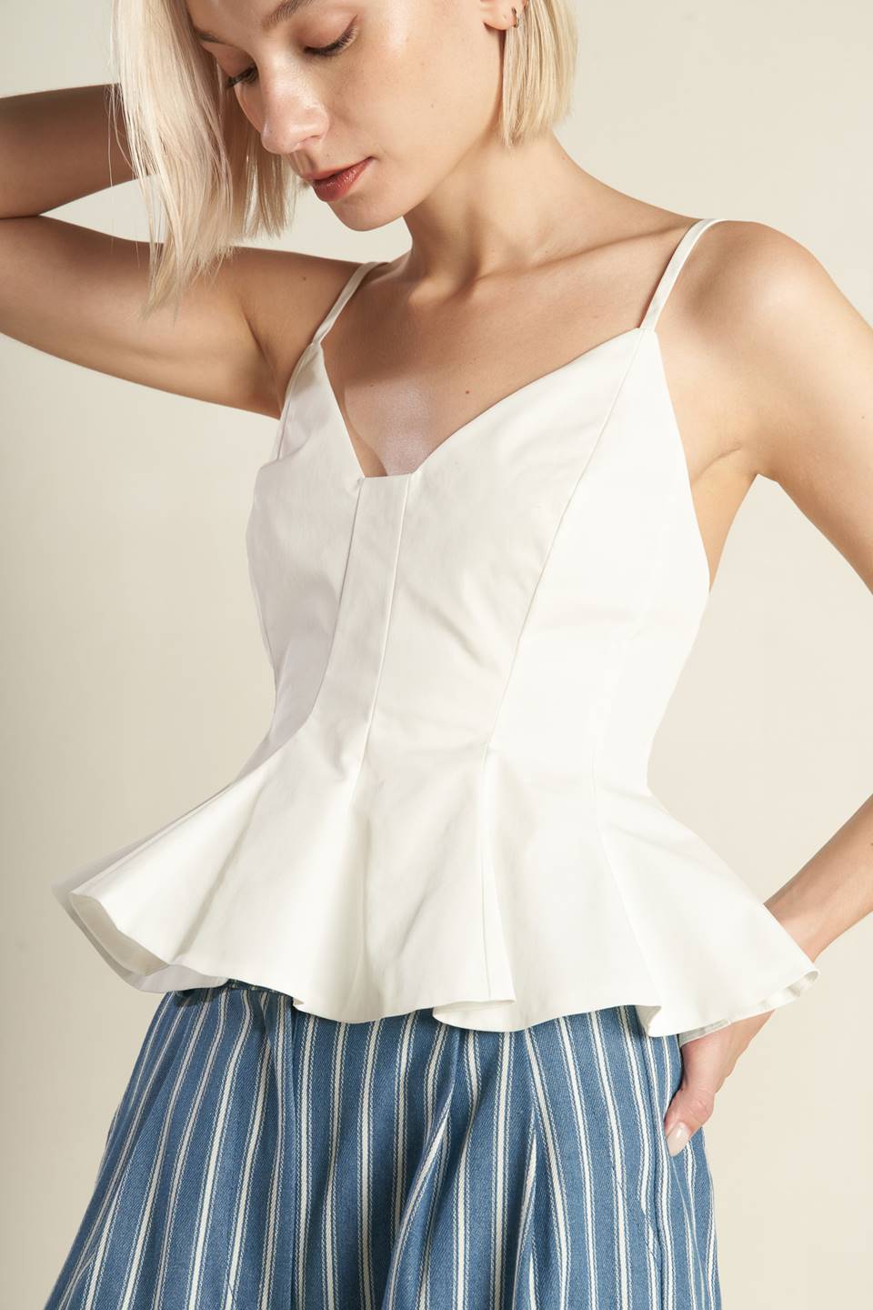 
A solid woven cami top featuring straps, peplum and back zipper closure. Matching pants FP1095.

Details:

Self : 100% Polyester

Size &amp; Fit

- Model is 5`8" And Wearing Size Small
- Measurements Taken From Size Small
- Approx. Length: 22"
