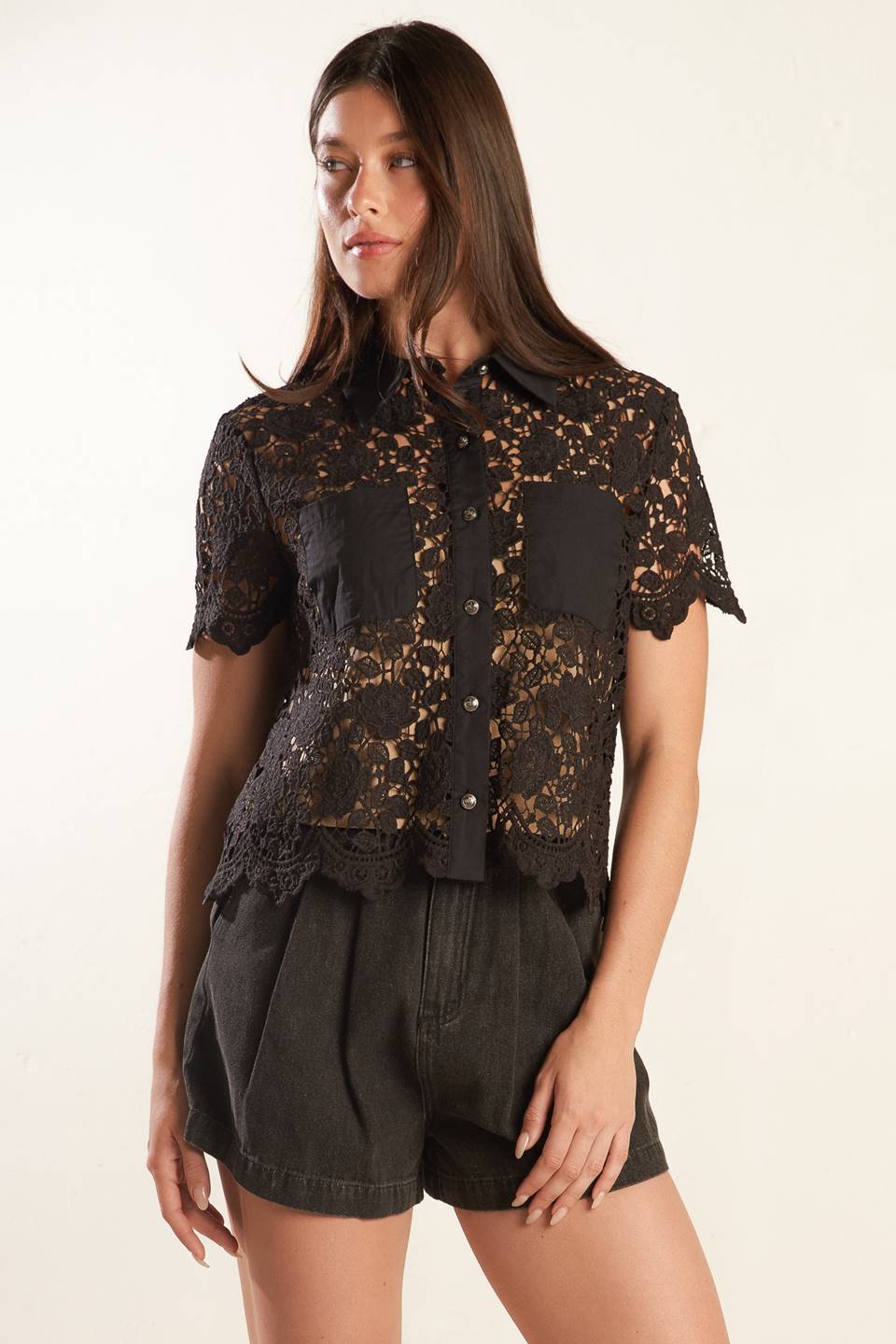 A black woven lace top with a collar, button down, and short sleeve 