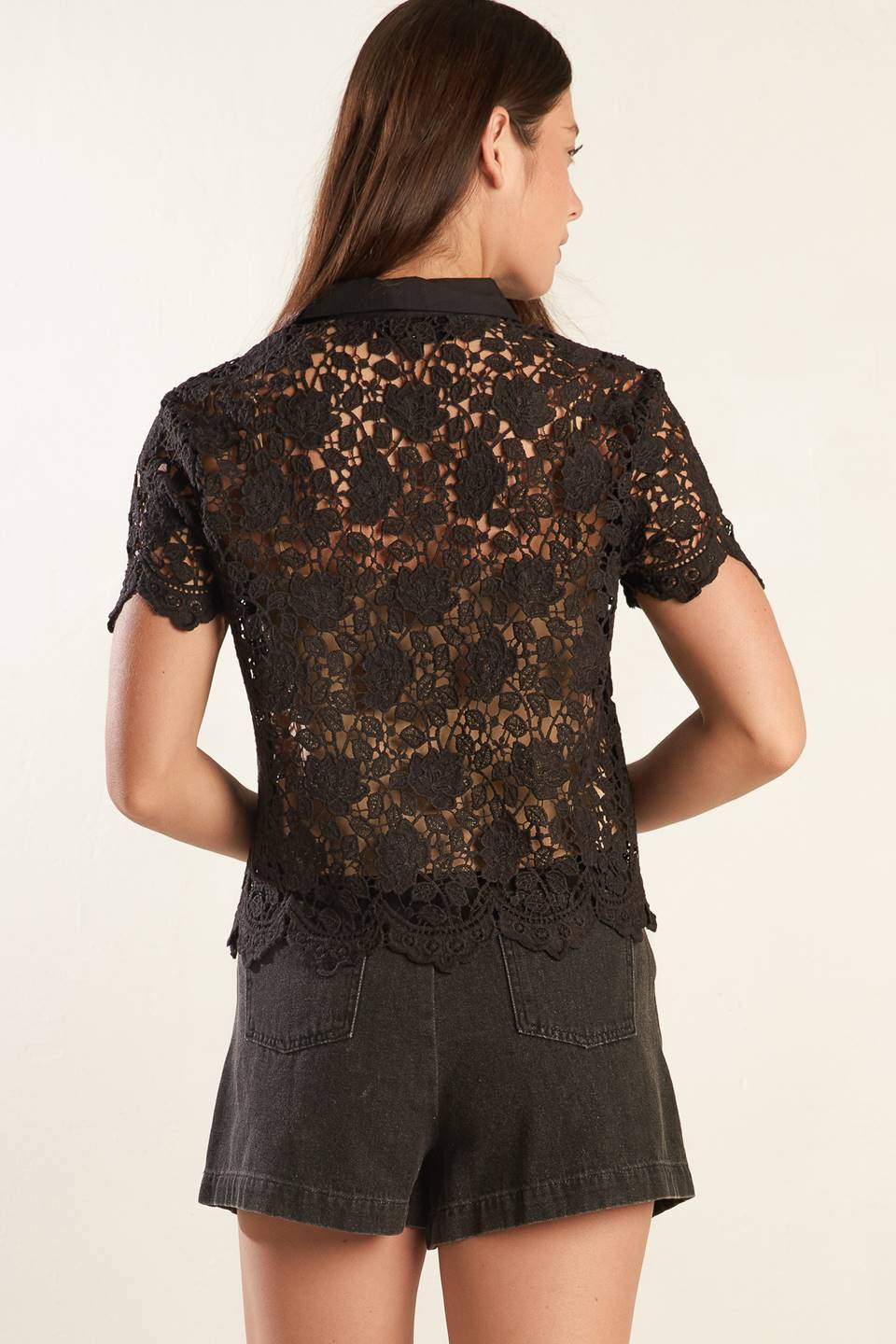 A black woven lace top with a collar, button down, and short sleeve 