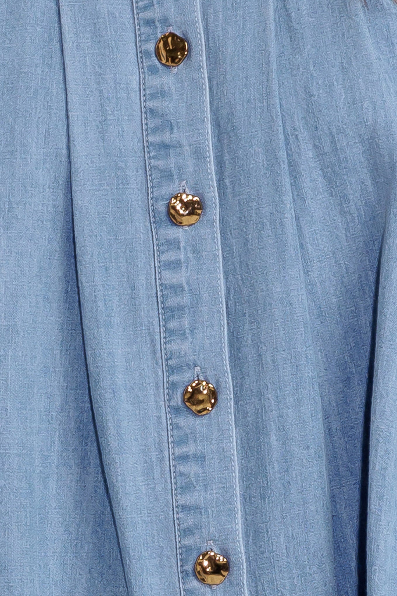 A washed chambray to featuring collar, button down, sleeveless and pleats.