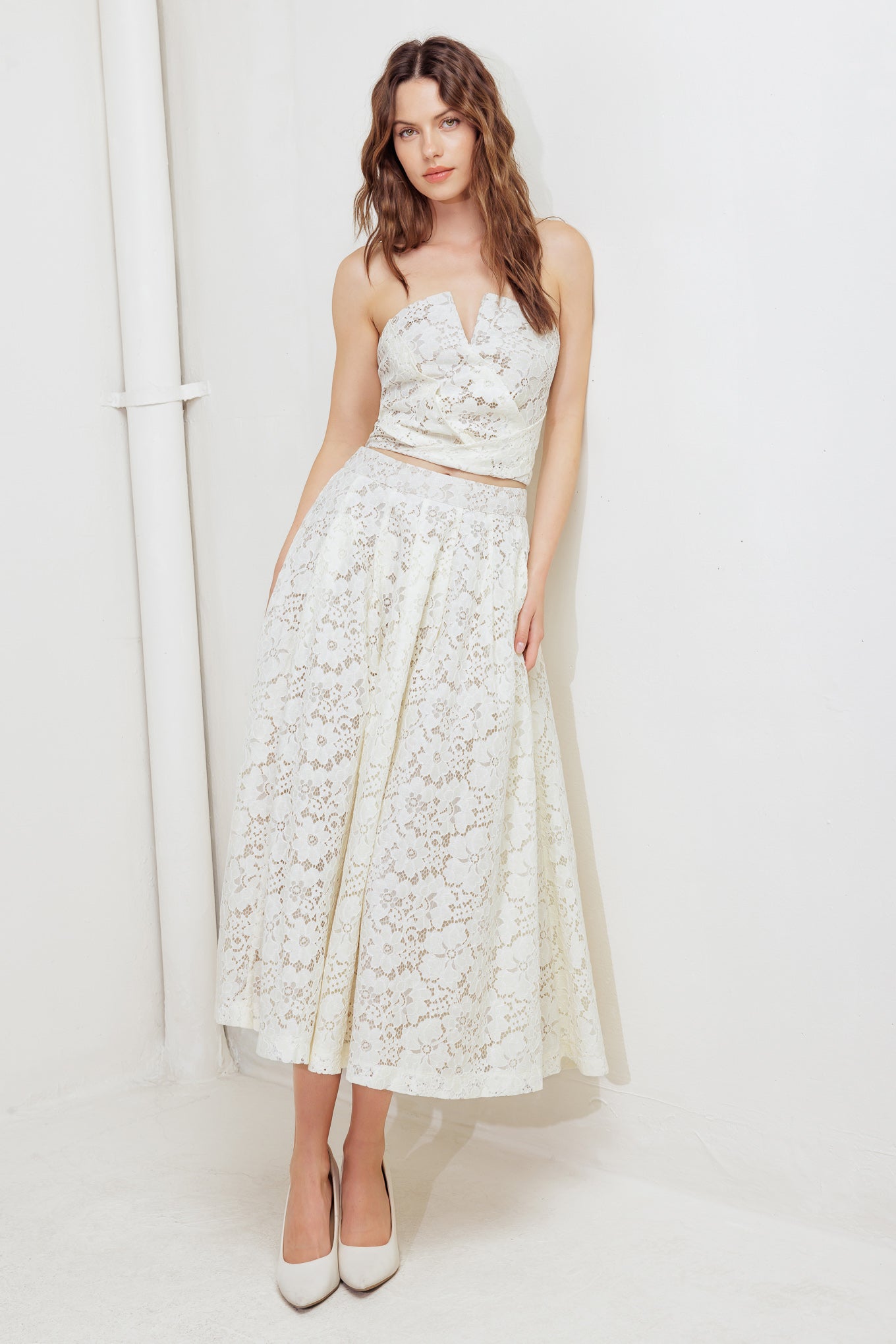 A woven lace tube top with smocked back bodice. Matching skirt FK1176