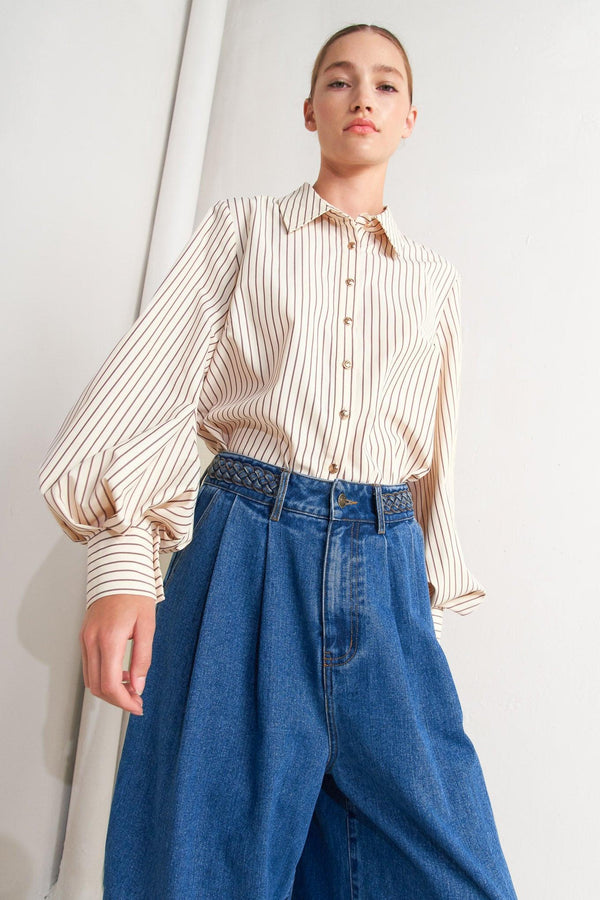 A striped woven top featuring collar, long sleeve and front button down
