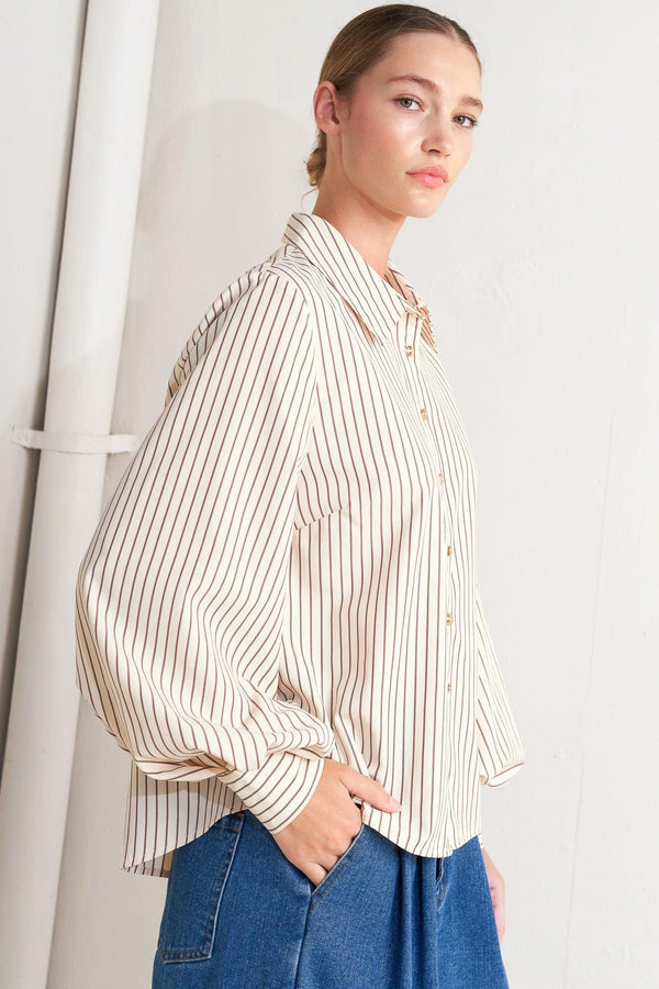 A striped woven top featuring collar, long sleeve and front button down