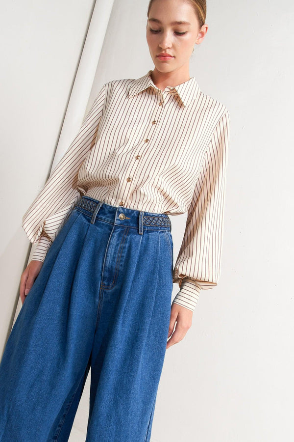 A striped woven top featuring collar, long sleeve and front button down