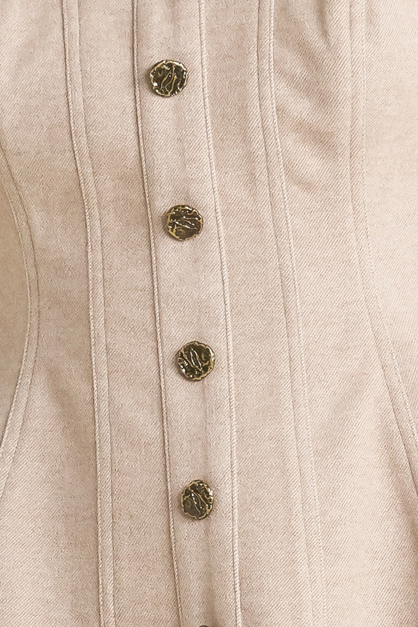 A solid knit top featuring strapless, front button detail and back zipper closure.