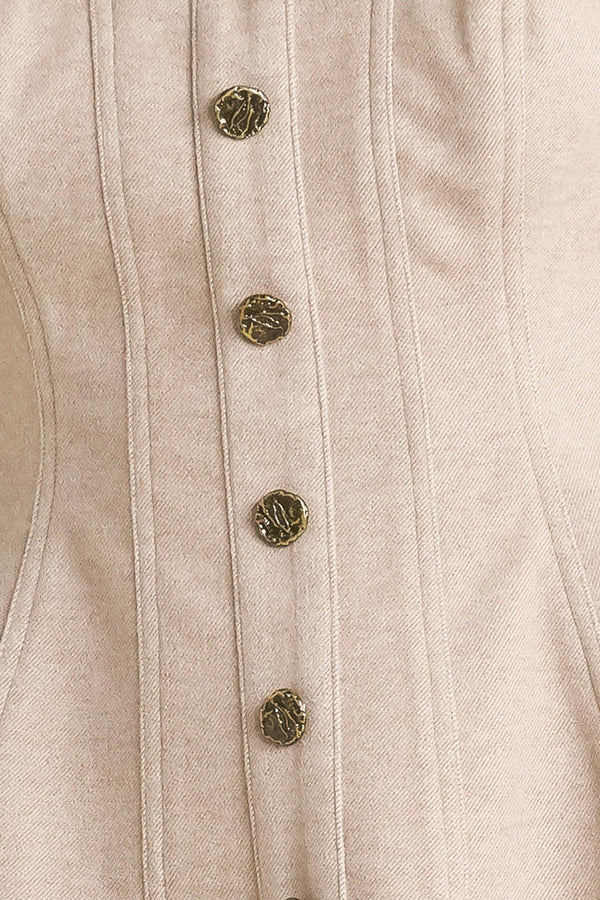 A solid knit top featuring strapless, front button detail and back zipper closure.