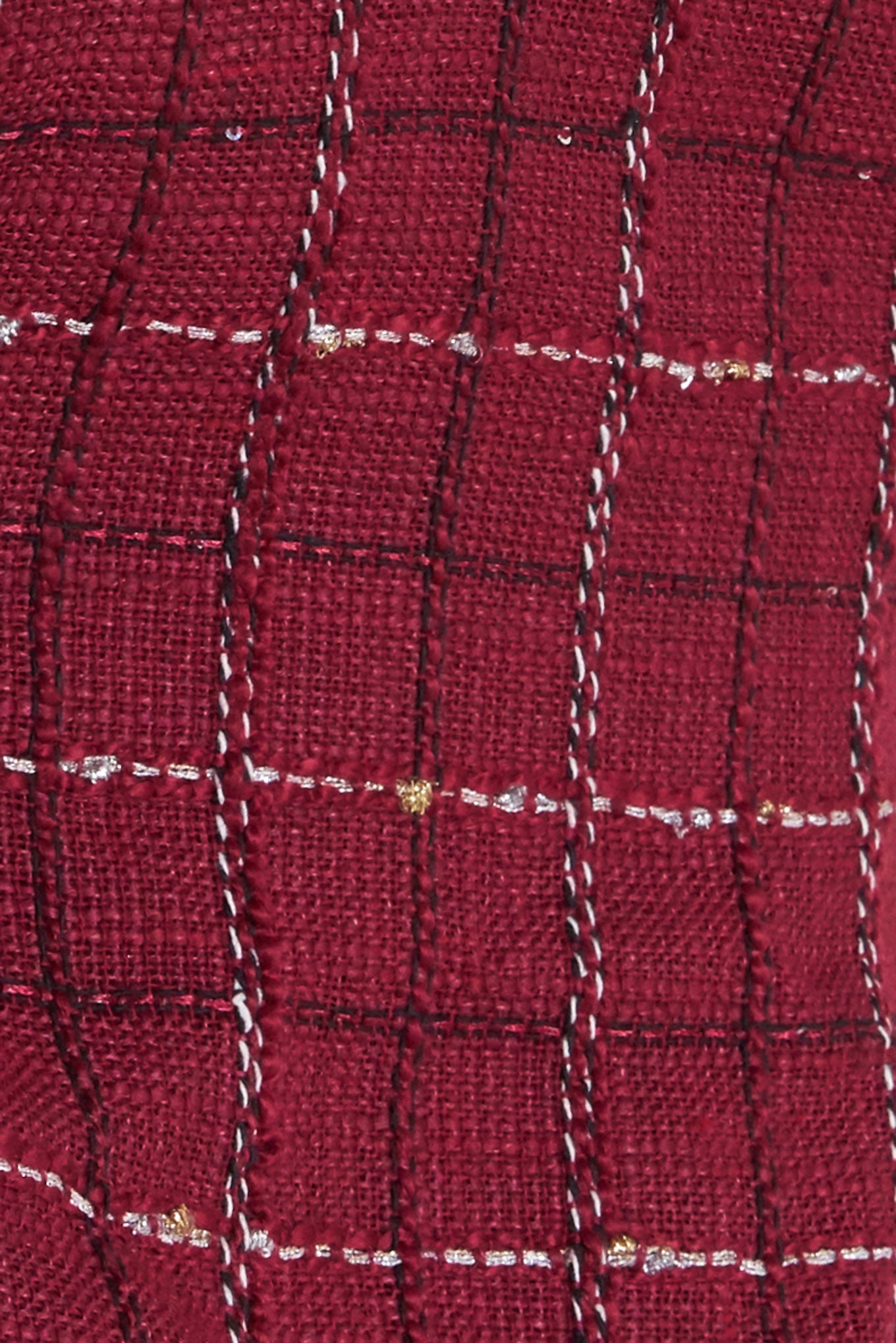 A tweed cami top featuring straps, peplum and back zipper closure