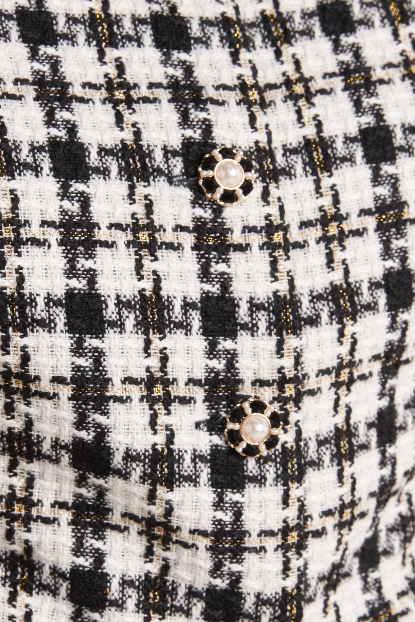A tweed vest featuring round neckline, sleeveless and front button down.