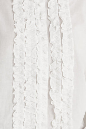 A solid woven top with a collar, button-down front, long sleeves, and front ruffle detail.