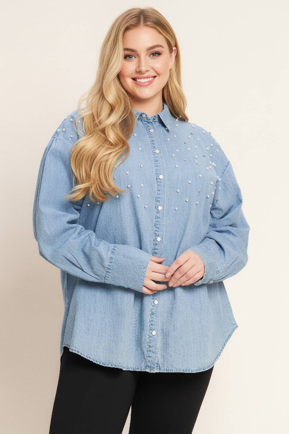 Woman wearing a light blue denim shirt on a beige background - Flying Tomato