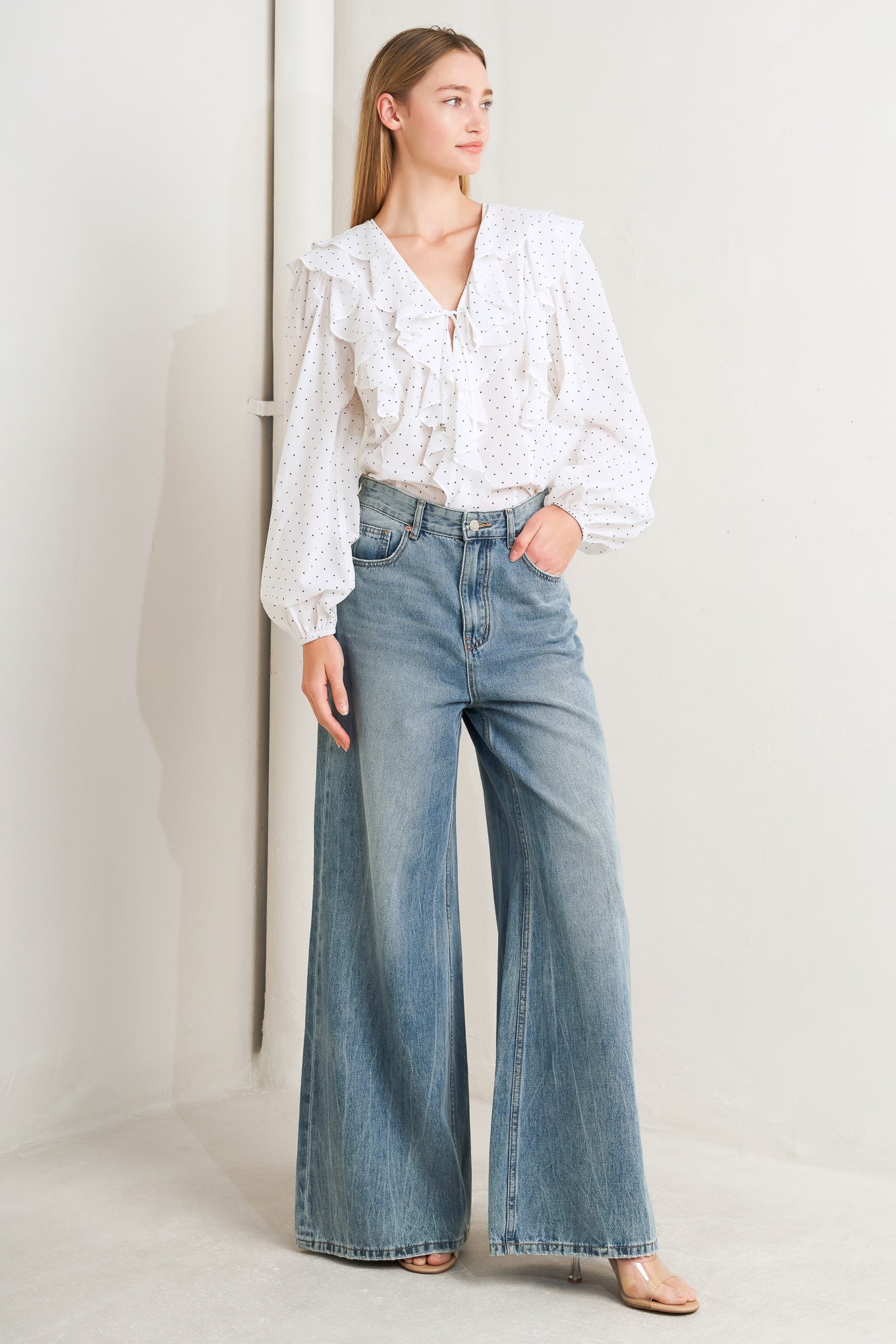 
A dotted woven top featuring V neckline, front tie, ruffles and long sleeve

Details:

Self : 100% Cotton

Size &amp; Fit

- Model is 5`8" And Wearing Size Small
- Measurements Taken From Size Small
- Approx. Length: 25" FLYING TOMATO