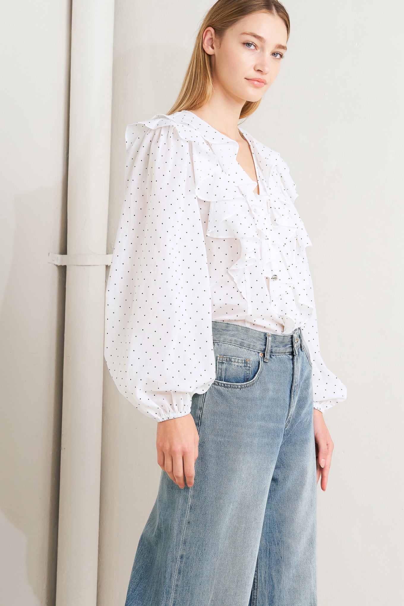 
A dotted woven top featuring V neckline, front tie, ruffles and long sleeve

Details:

Self : 100% Cotton

Size &amp; Fit

- Model is 5`8" And Wearing Size Small
- Measurements Taken From Size Small
- Approx. Length: 25" FLYING TOMATO