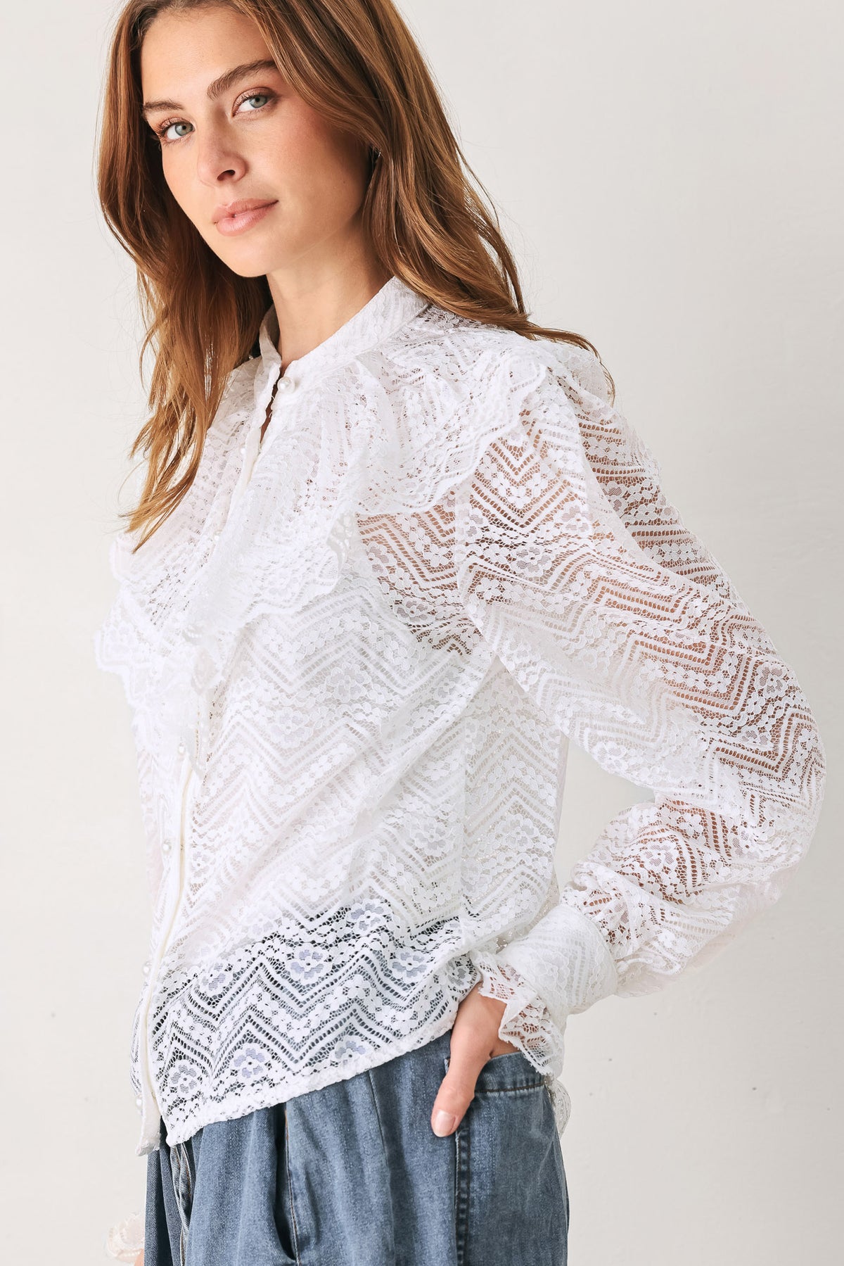 A woman wearing a white long-sleeve lace blouse with a ruffled collar | FREEMARKET