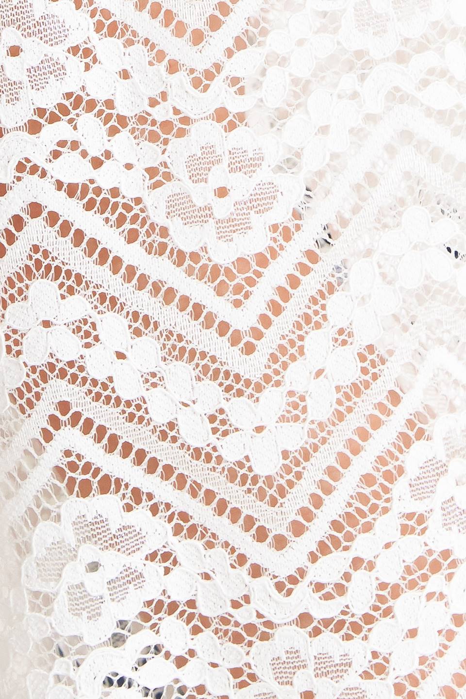 A woven lace top featuring high neckline, ruffles, long sleeve with cuff, button down closure and cami