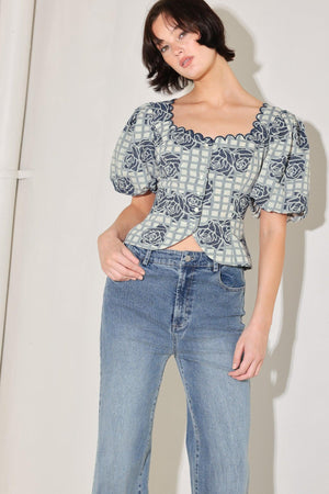 
A woven jacquard top featuring square neckline with scallop edge, short puff sleeve and button down.&nbsp;

Details:

Self : 60% Cotton 40% Polyester

Size &amp; Fit

- Model is 5`8" And Wearing Size Small
- Measurements Taken From Size Small
- Approx. Length: 19"