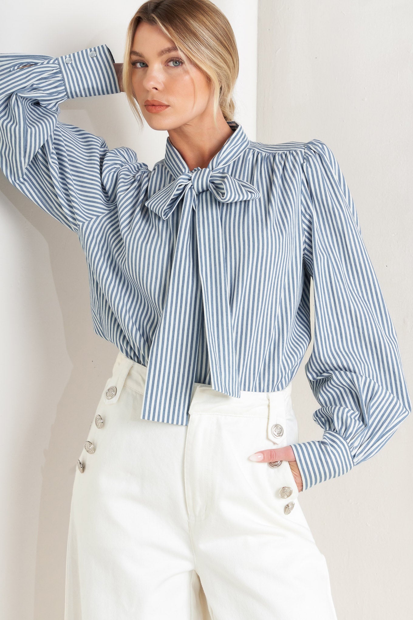 
A striped woven top featuring bow tie front, button down and long sleeve with wide cuff

Details:

Self : 100% Cotton

Size &amp; Fit

- Model is 5`8" And Wearing Size Small
- Measurements Taken From Size Small
- Approx. Length: 25"