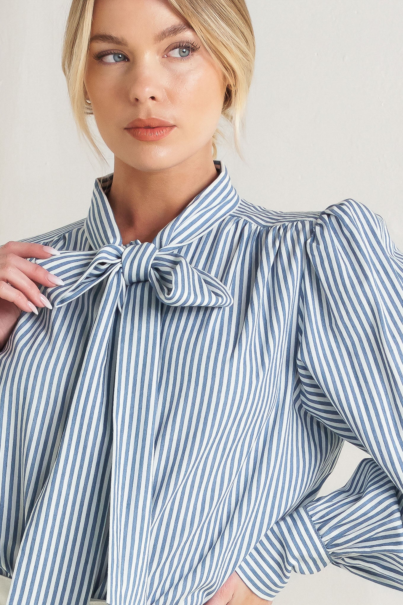 A striped woven top featuring bow tie front, button down and long sleeve with wide cuff

Details:

Self: 100% Cotton

Size & Fit

- Model is 5`8" And Wearing Size Small
- Measurements Taken From Size Small
- Approx. Length: 25"