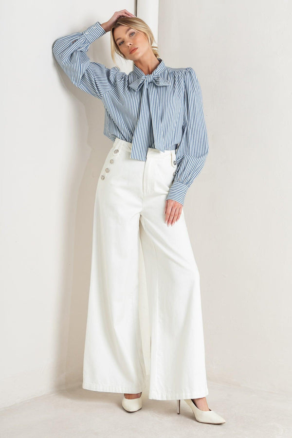 A striped woven top featuring bow tie front, button down and long sleeve with wide cuff

Details:

Self: 100% Cotton

Size & Fit

- Model is 5`8" And Wearing Size Small
- Measurements Taken From Size Small
- Approx. Length: 25"
