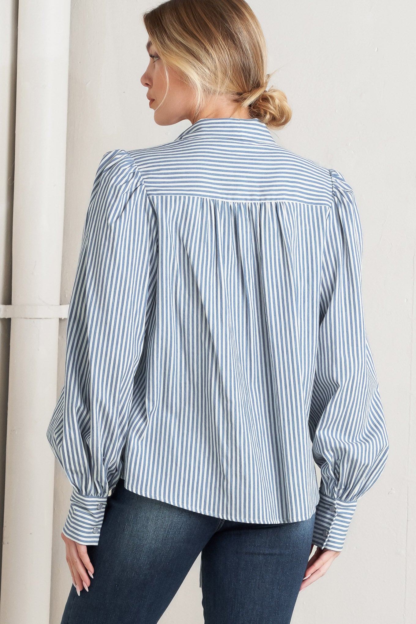 
A striped woven top featuring bow tie front, button down and long sleeve with wide cuff

Details:

Self : 100% Cotton

Size &amp; Fit

- Model is 5`8" And Wearing Size Small
- Measurements Taken From Size Small
- Approx. Length: 25"