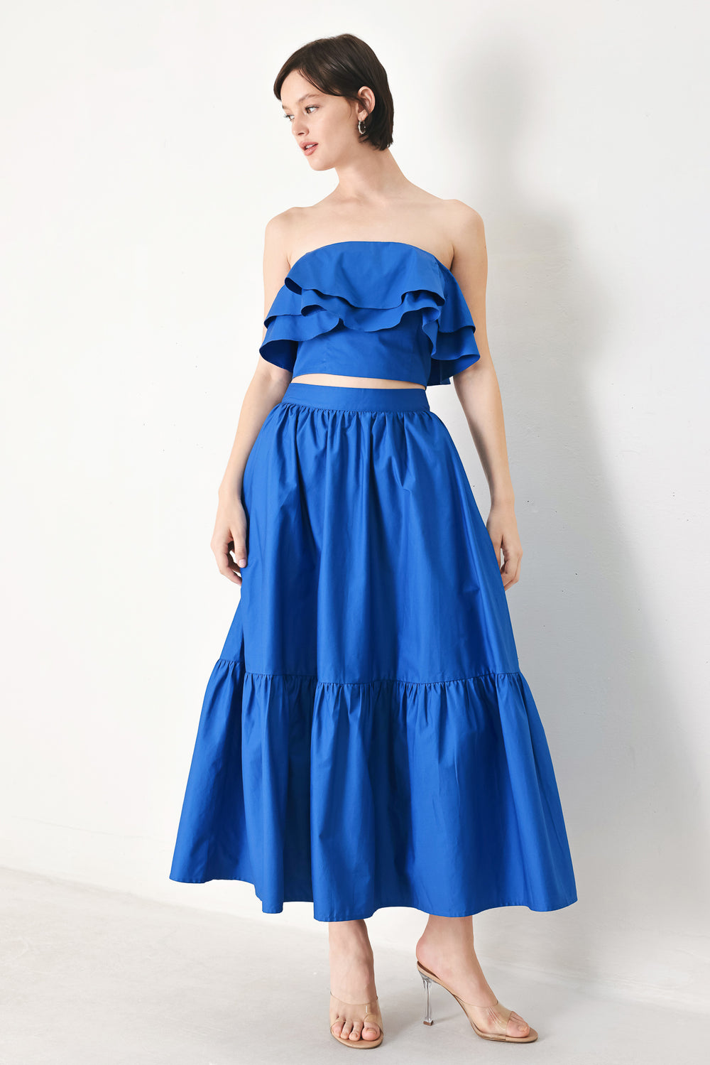 Woman wearing a blue ruffled top | FREEMARKET | Flying Tomato