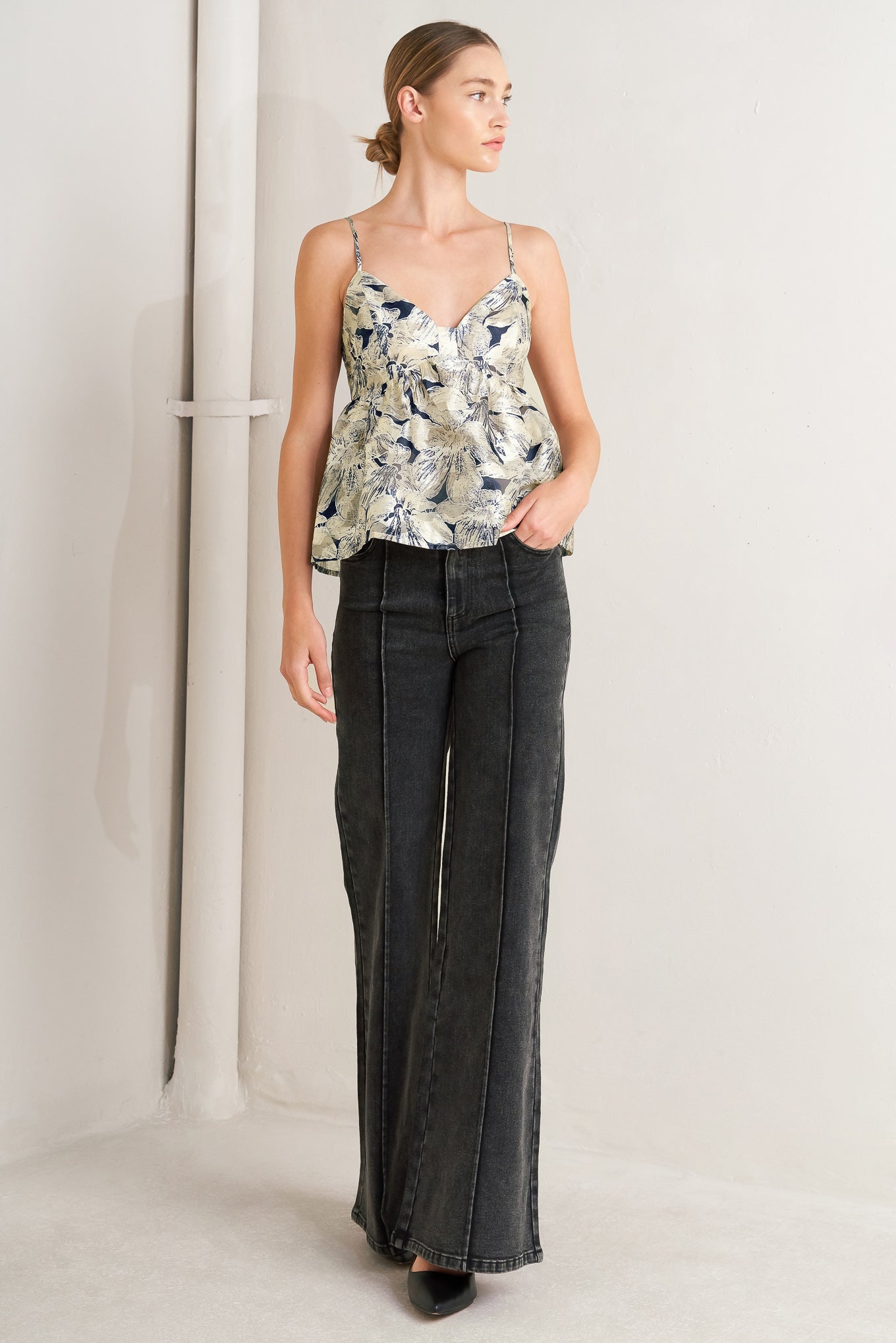 A woven textured top with back zipper closure