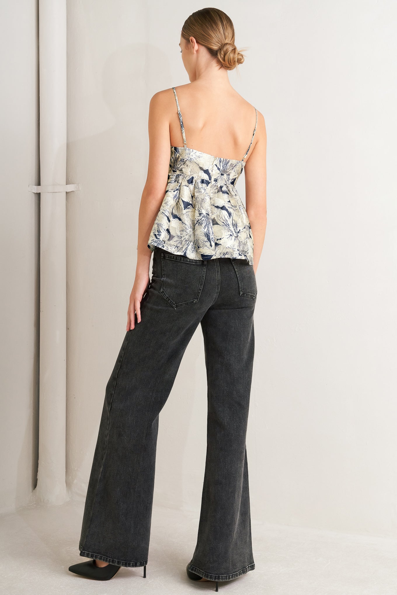 A woven textured top with back zipper closure